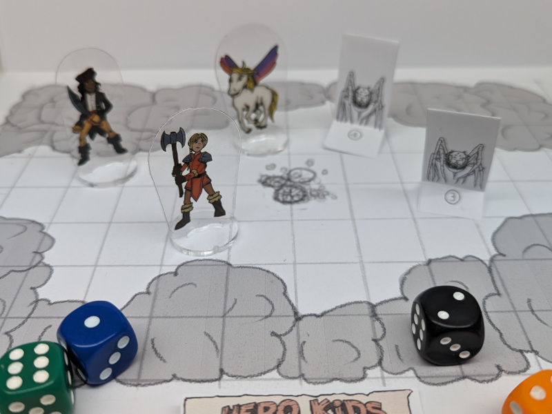 Hero Kids Nederlands speelveld met helden, monsters en dobbelstenen
